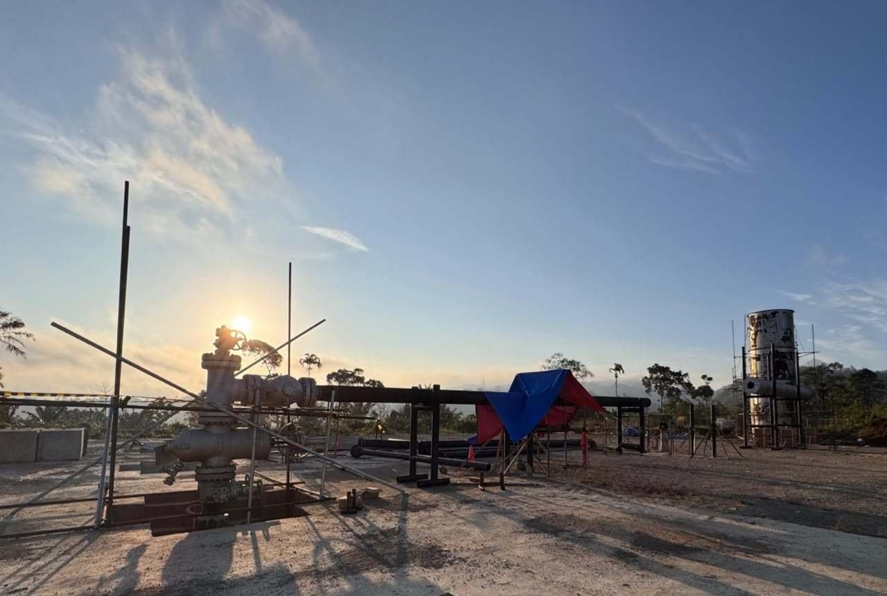 Wellhead and separator vessel prepared for production testing at sunrise