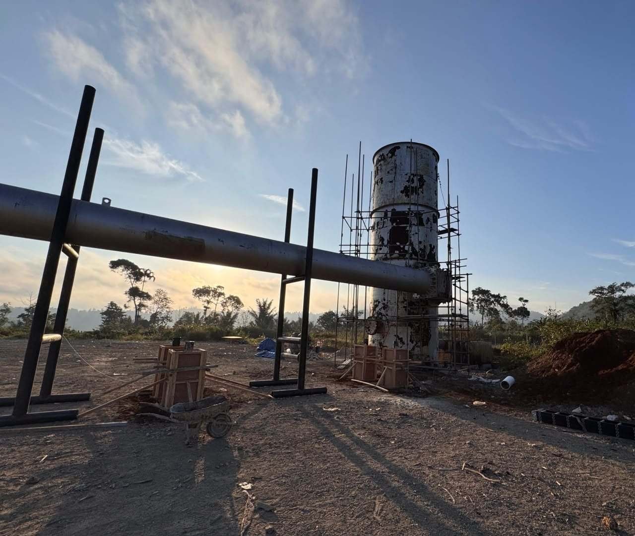 Production testing separator and silencer tower under construction with scaffolding
